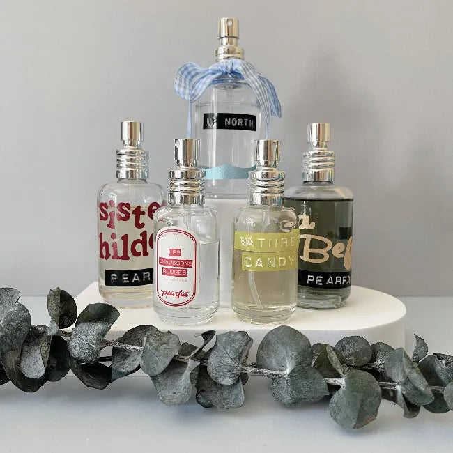 Perfume bottles from Pearfat perfume with visible graphics on a white background